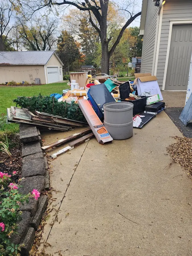 Dumpster being loaded with debris for 12 Yard Dumpster Rental in Ottawa